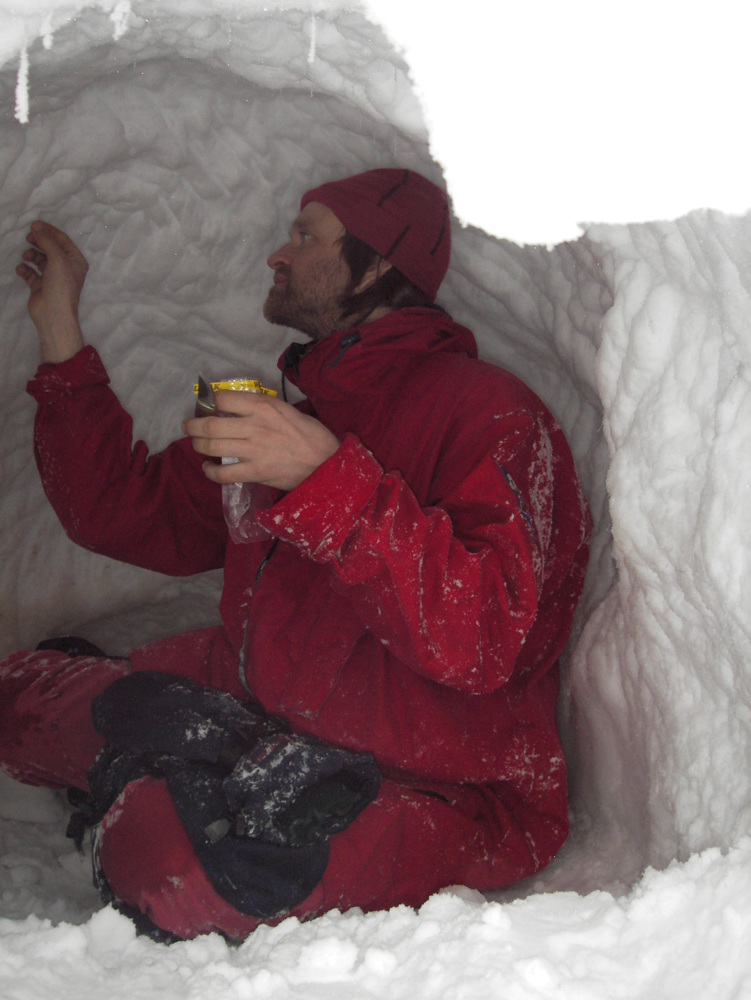 Man sitting i a snow cave