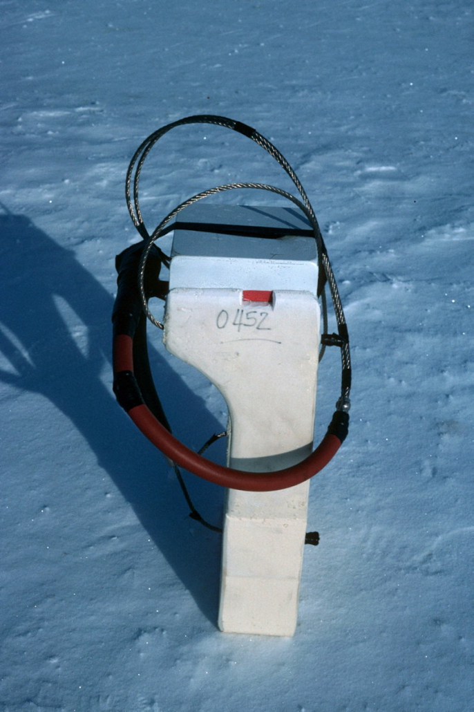 Old satellite transmitter placed in snow